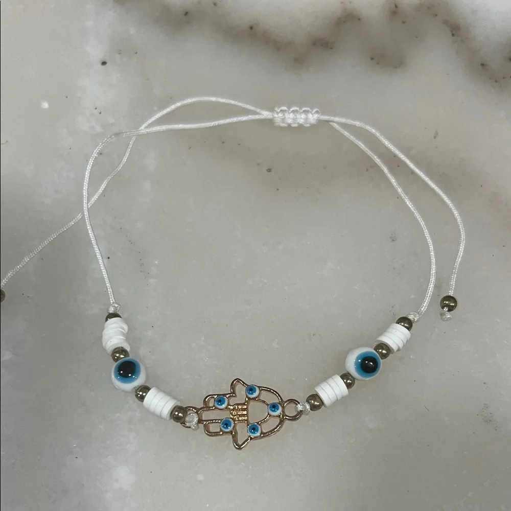 Chic Gold and White Hamsa Bracelet with Blue Accents